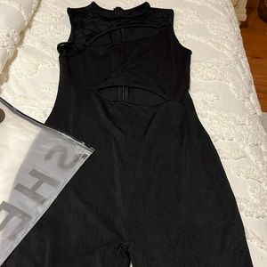 Never worn romper with cut out